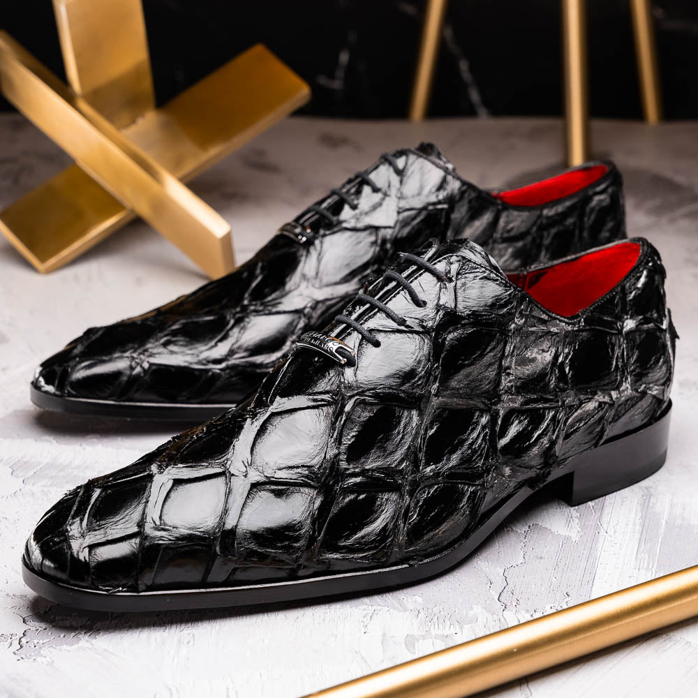 The Olivieri Black by Marco Di Milano: luxurious black crocodile-patterned leather oxfords with red interior lining, displayed to show off the striking brown sole—a true statement in designer footwear.