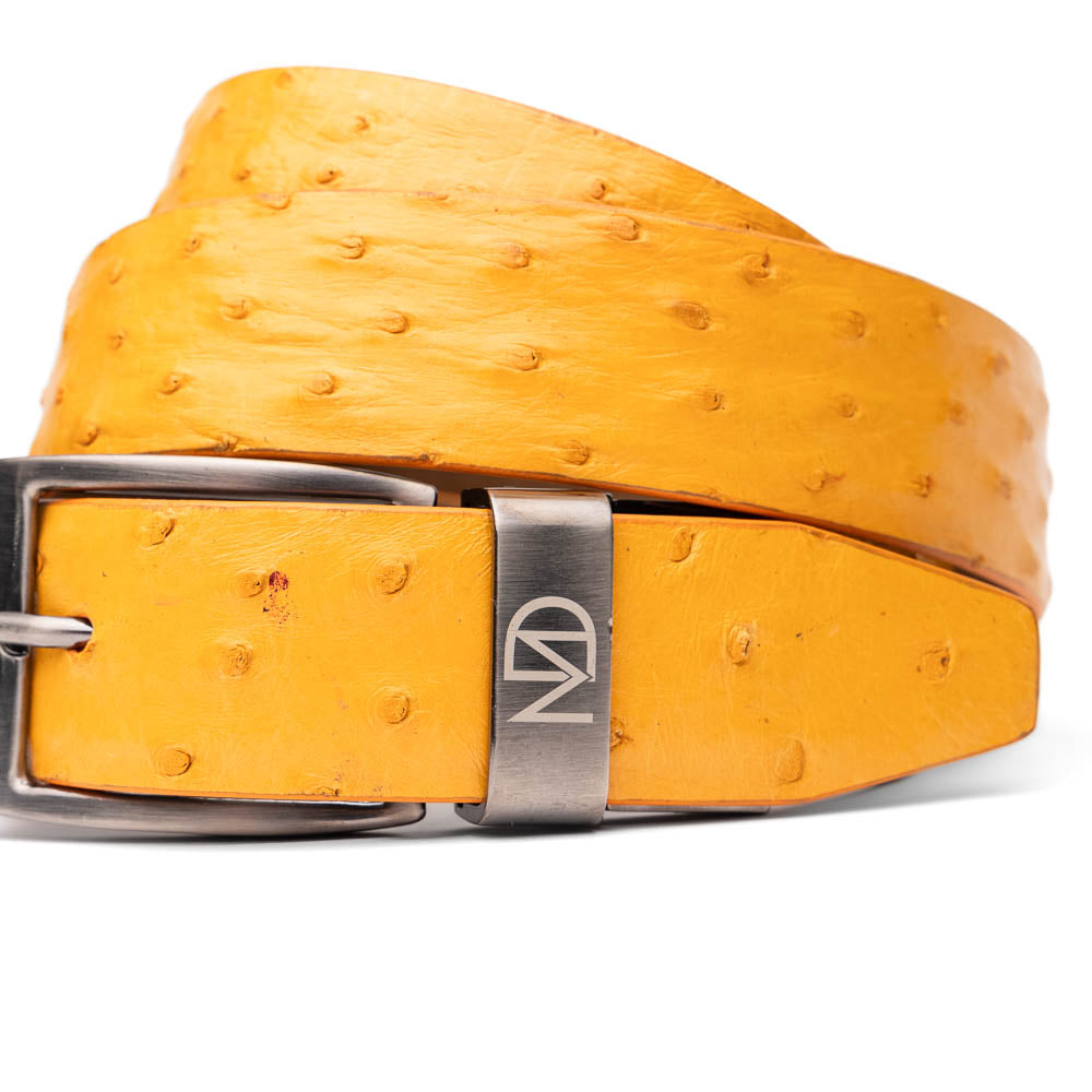 The Domenico Belt Buttercup by Marco Di Milano is a coiled yellow ostrich leather belt with a silver buckle engraved with the brand's logo—an elegant match for luxury footwear and signature ostrich belts.