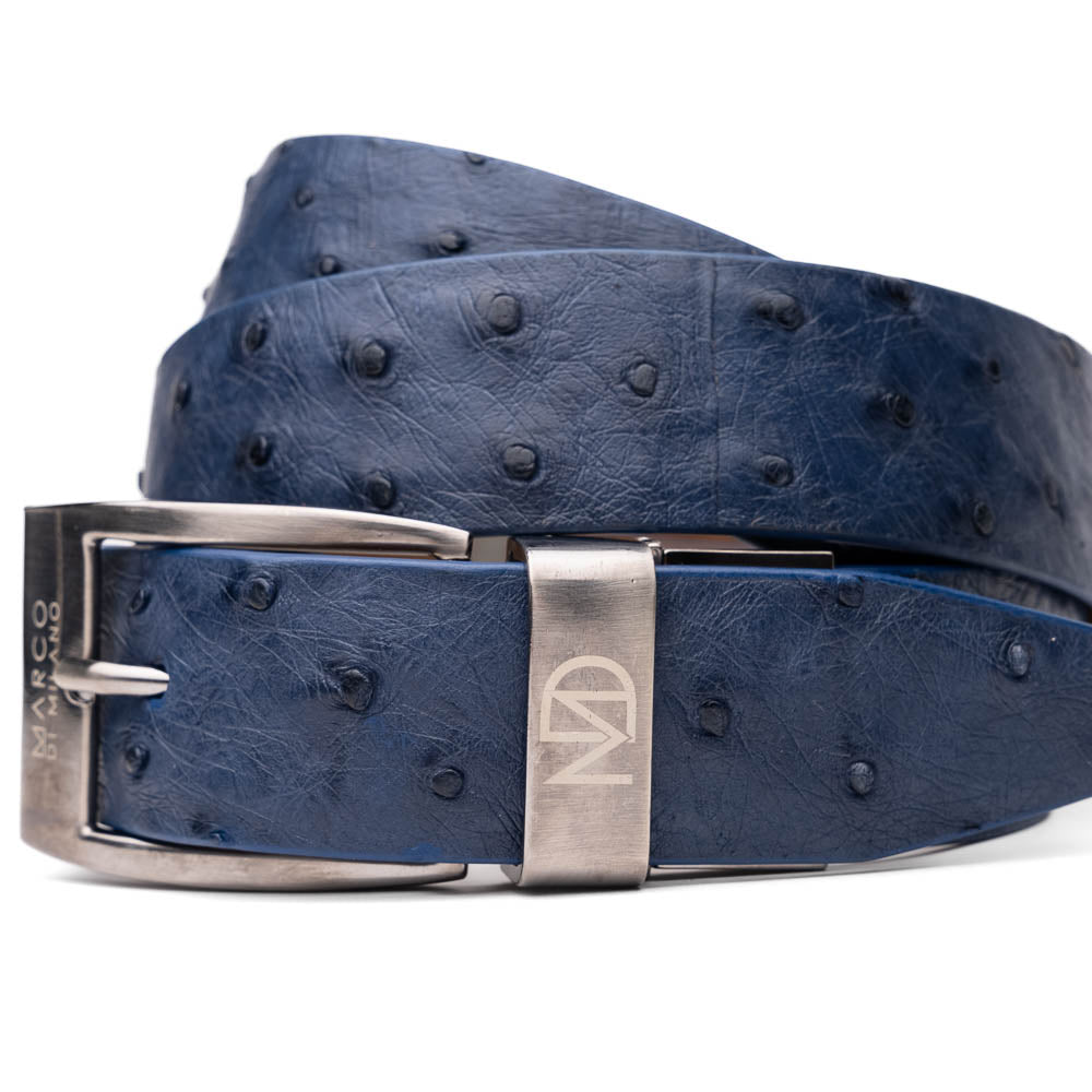 The Domenico Belt Navy by Marco Di Milano is crafted from blue ostrich leather, features a silver buckle engraved with the brand’s logo, and makes an elegant match for their luxury footwear.