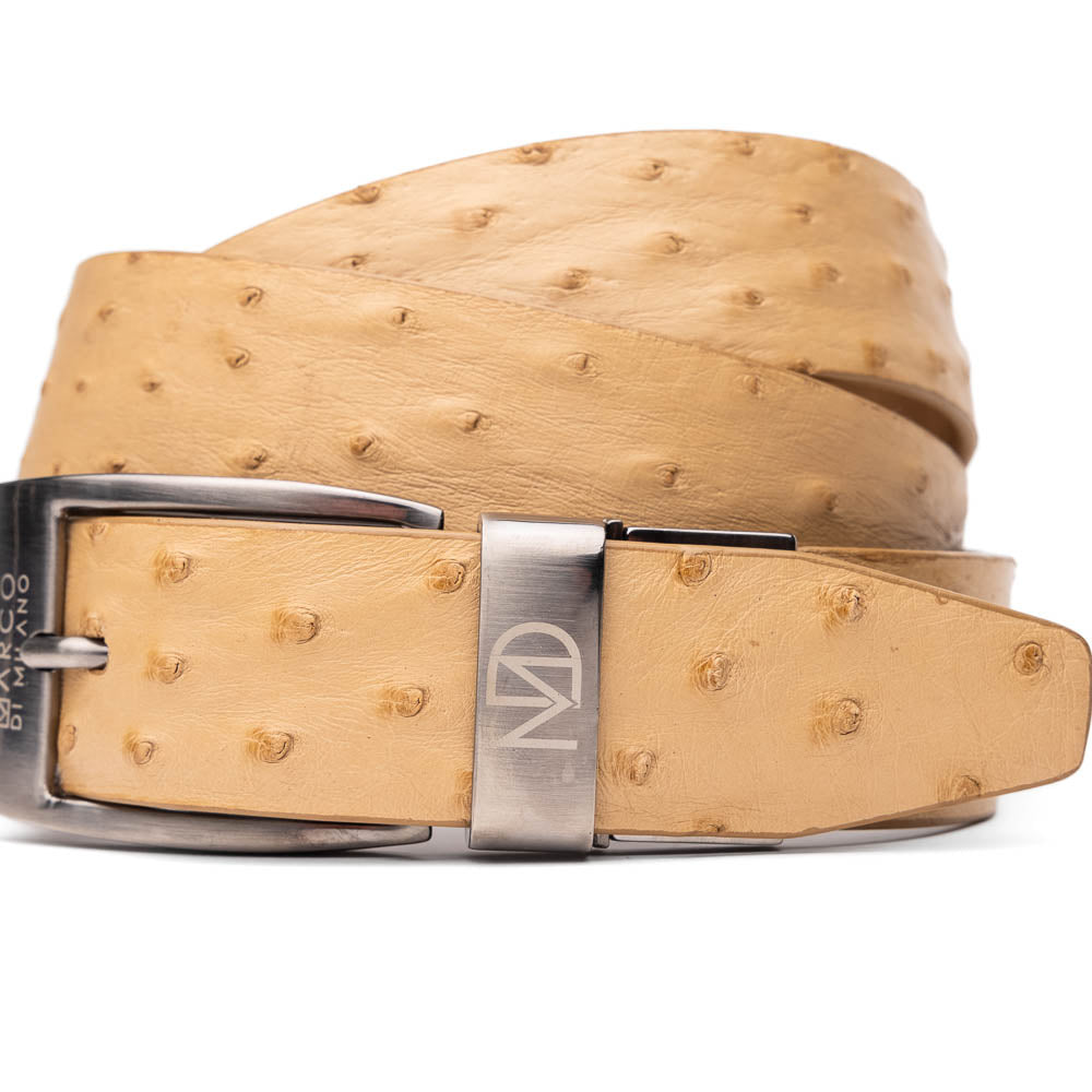 The Domenico Belt Orix by Marco Di Milano is a tan ostrich leather belt with a silver buckle featuring the brand's logo—a refined accessory from the esteemed designer.