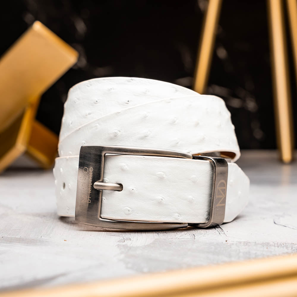 The Domenico Belt White by Marco Di Milano is a white leather belt with a silver buckle, subtle ostrich-inspired texture, and embossed Marco Di Milano branding on the strap and buckle.