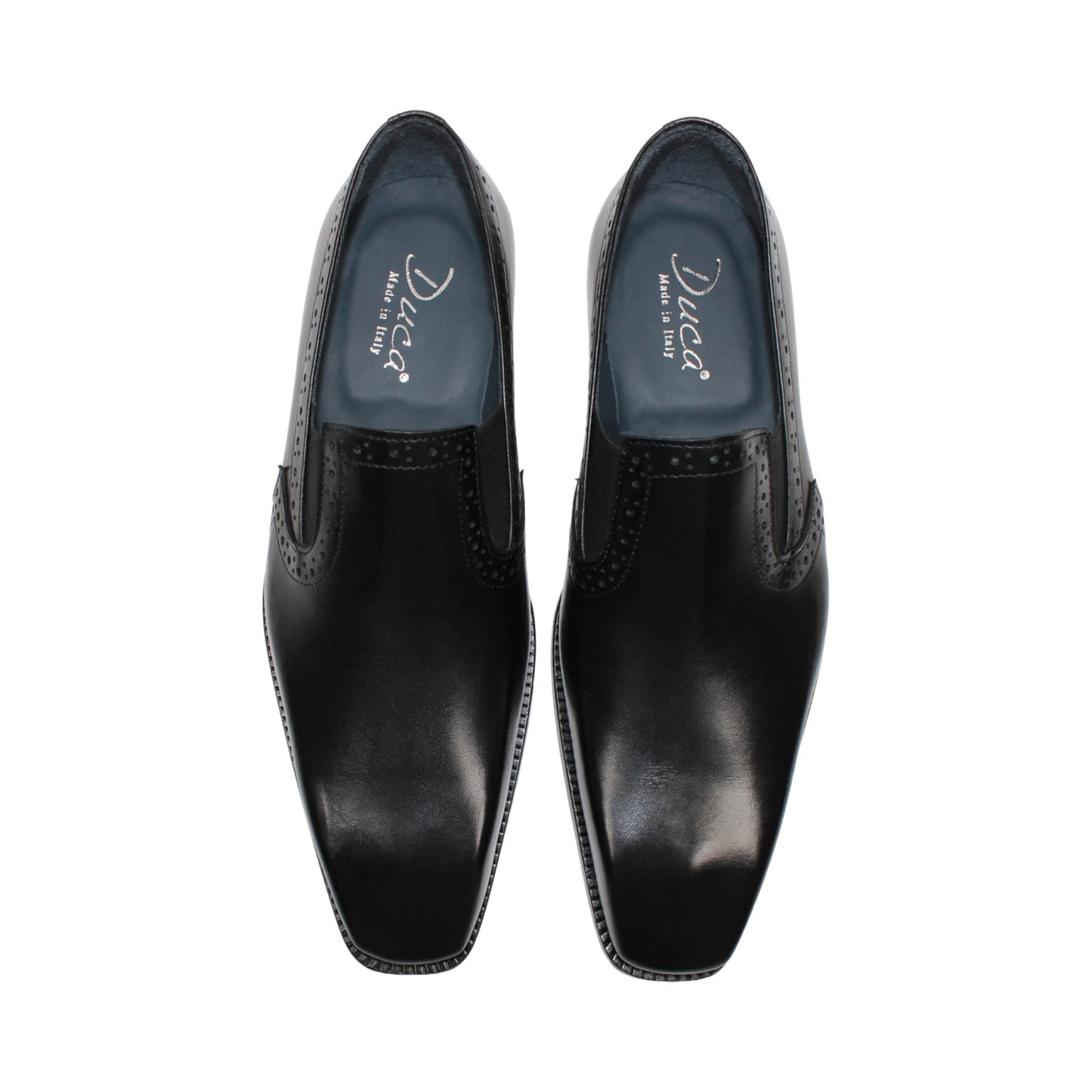 The Duca Di Matiste Duca Paliano Black is an Italian-made slip-on dress shoe in premium black calf leather, featuring a low heel and decorative perforations, shown in profile for timeless style.