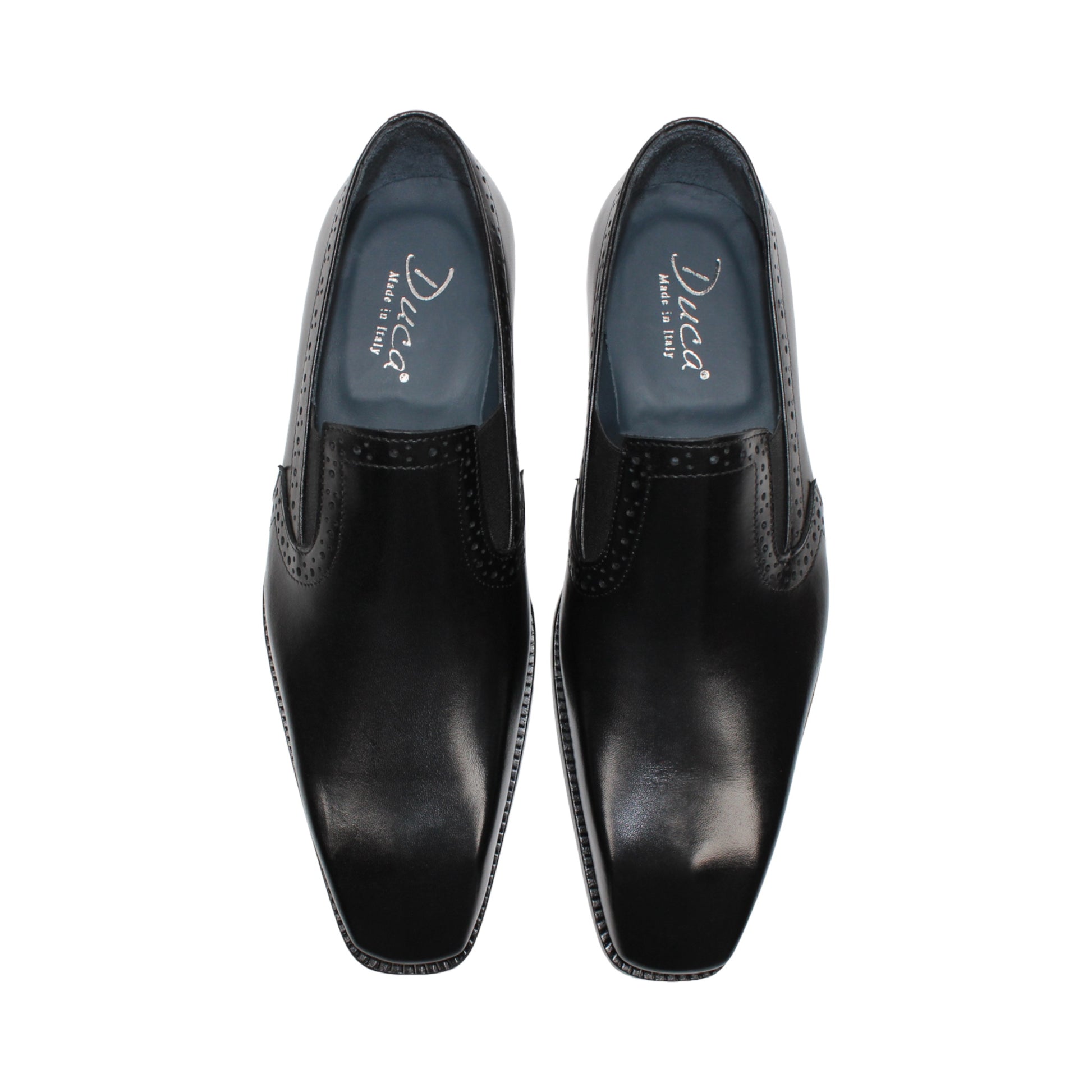 The Duca Di Matiste Duca Paliano Black is an Italian-made slip-on dress shoe in premium black calf leather, featuring a low heel and decorative perforations, shown in profile for timeless style.