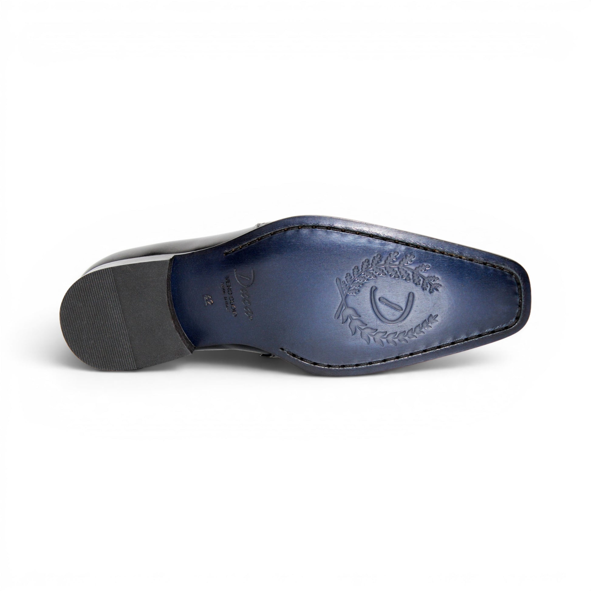 The Duca Di Matiste Duca Paliano Black is an Italian-made slip-on dress shoe in premium black calf leather, featuring a low heel and decorative perforations, shown in profile for timeless style.