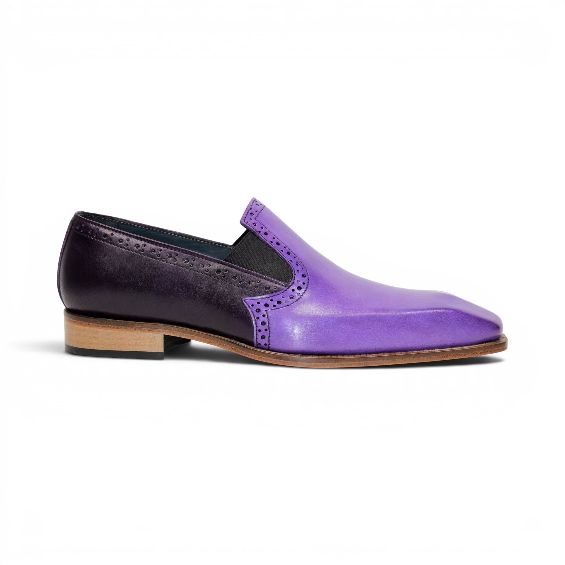 The Duca Di Matiste Duca Paliano Lavender/Purple is an Italian-made men's slip-on dress shoe in purple calf leather, with a darker purple heel, black elastic inserts, and a light brown sole for timeless style.