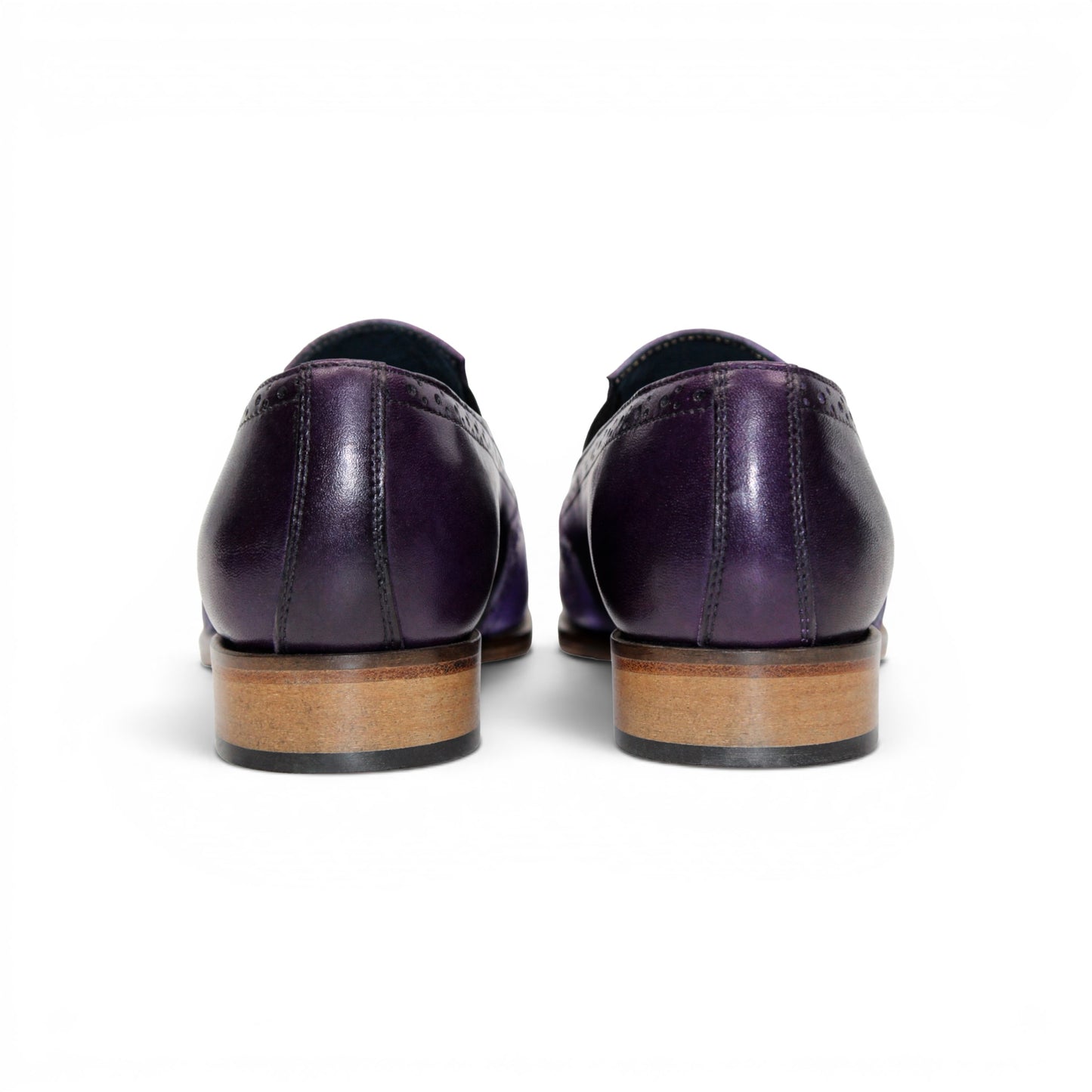 The Duca Di Matiste Duca Paliano Lavender/Purple is an Italian-made men's slip-on dress shoe in purple calf leather, with a darker purple heel, black elastic inserts, and a light brown sole for timeless style.