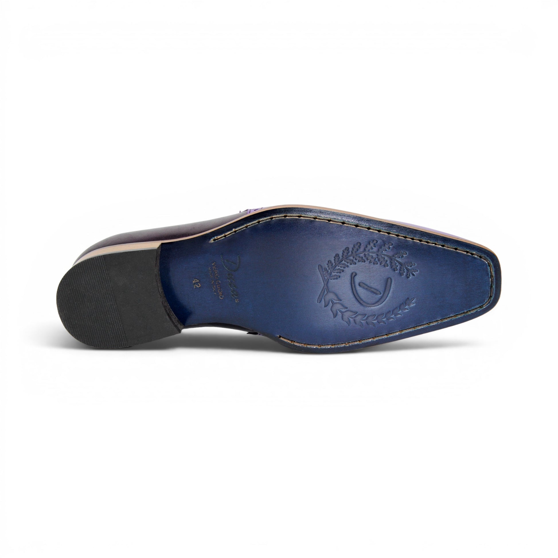 The Duca Di Matiste Duca Paliano Lavender/Purple is an Italian-made men's slip-on dress shoe in purple calf leather, with a darker purple heel, black elastic inserts, and a light brown sole for timeless style.