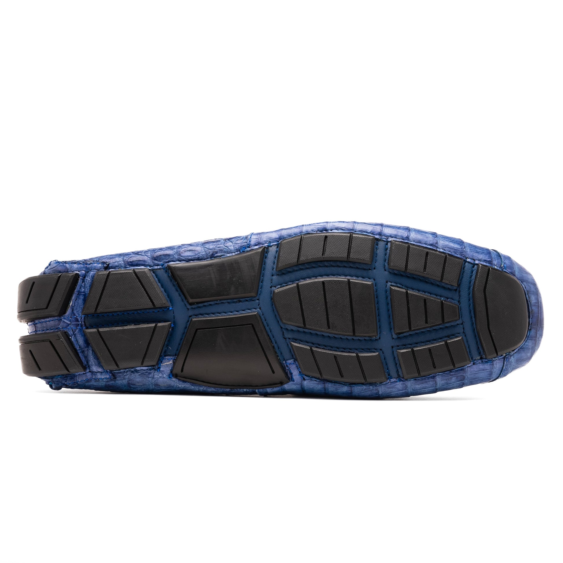 The Marco Di Milano Parma Blue Jeans loafers feature genuine blue caiman leather with a crocodile pattern, metal hardware accents, and rubber soles—ideal luxury footwear, displayed with one shoe upright and the other on its side.