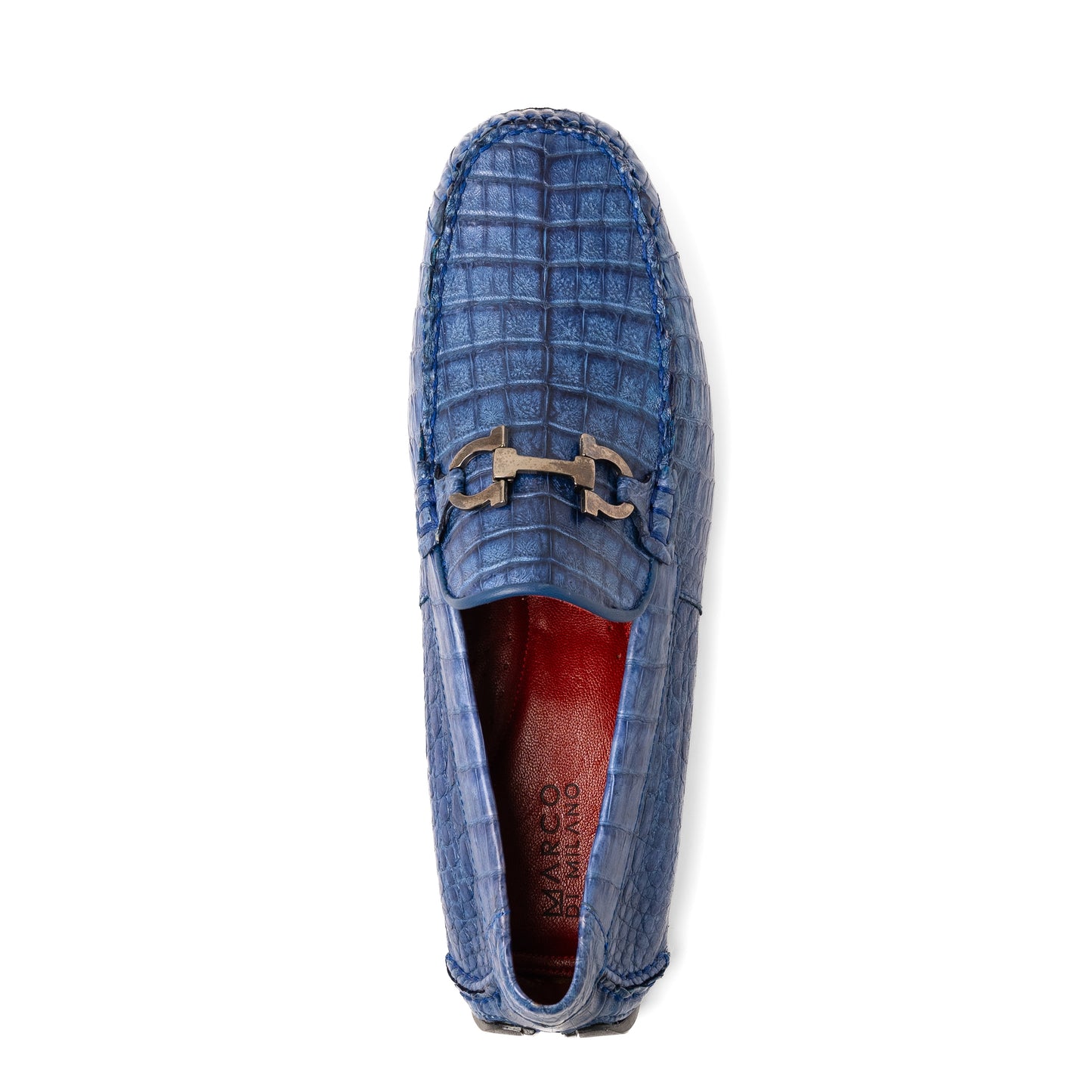 The Marco Di Milano Parma Blue Jeans loafers feature genuine blue caiman leather with a crocodile pattern, metal hardware accents, and rubber soles—ideal luxury footwear, displayed with one shoe upright and the other on its side.