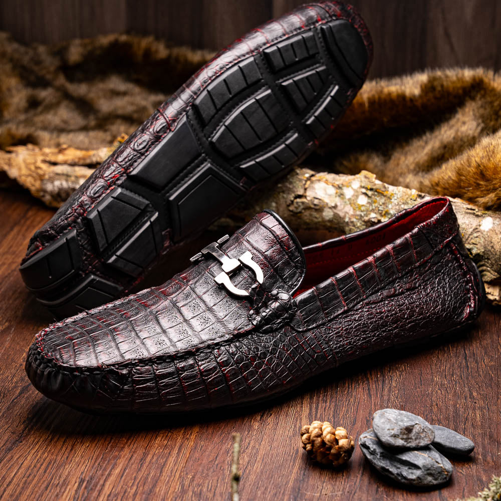 The Marco Di Milano Parma Blackcherry loafers feature genuine caiman leather with a crocodile pattern and metal buckle detail—luxury men's slip-ons shown upright and angled to display the sole, designed for effortless elegance.