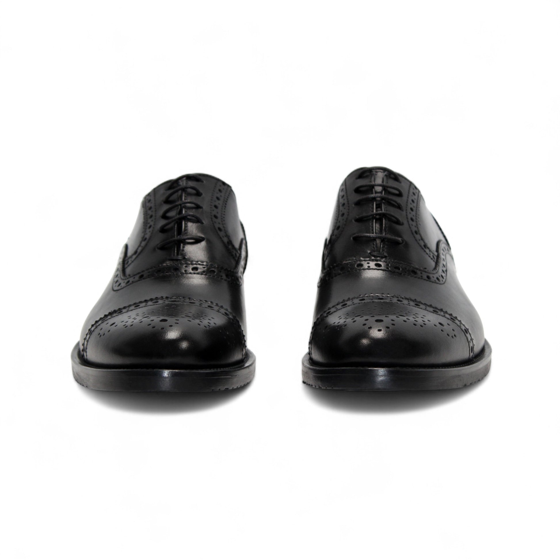 The Firmani Paul Black by Firmani is a black genuine leather oxford dress shoe with brogue detailing, laces, and a low heel, shown from the side against a white background.
