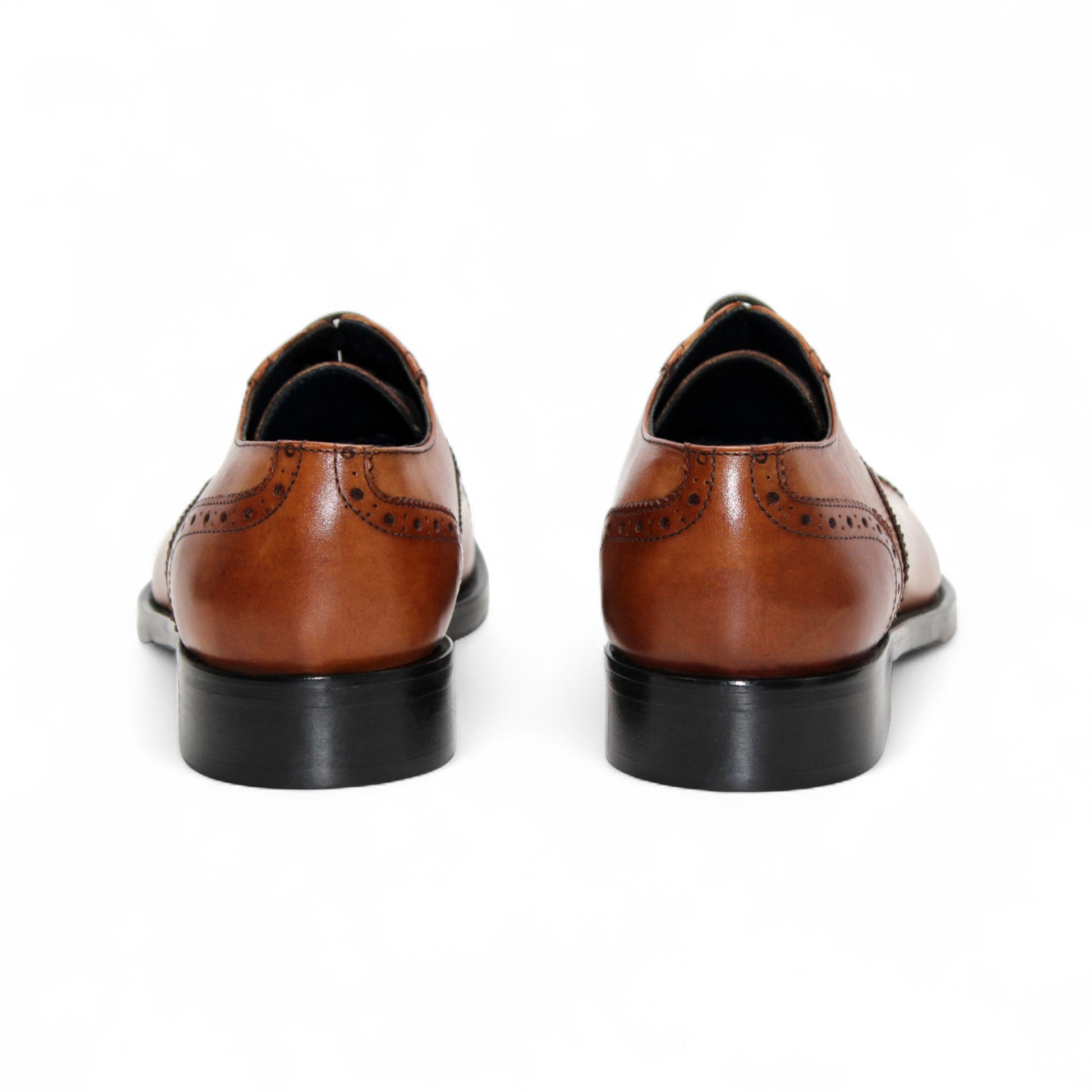 The Firmani Paul Cognac men's dress shoe by Firmani features genuine leather, decorative brogue detailing, black sole, and laces, displayed in a side profile view on a white background.