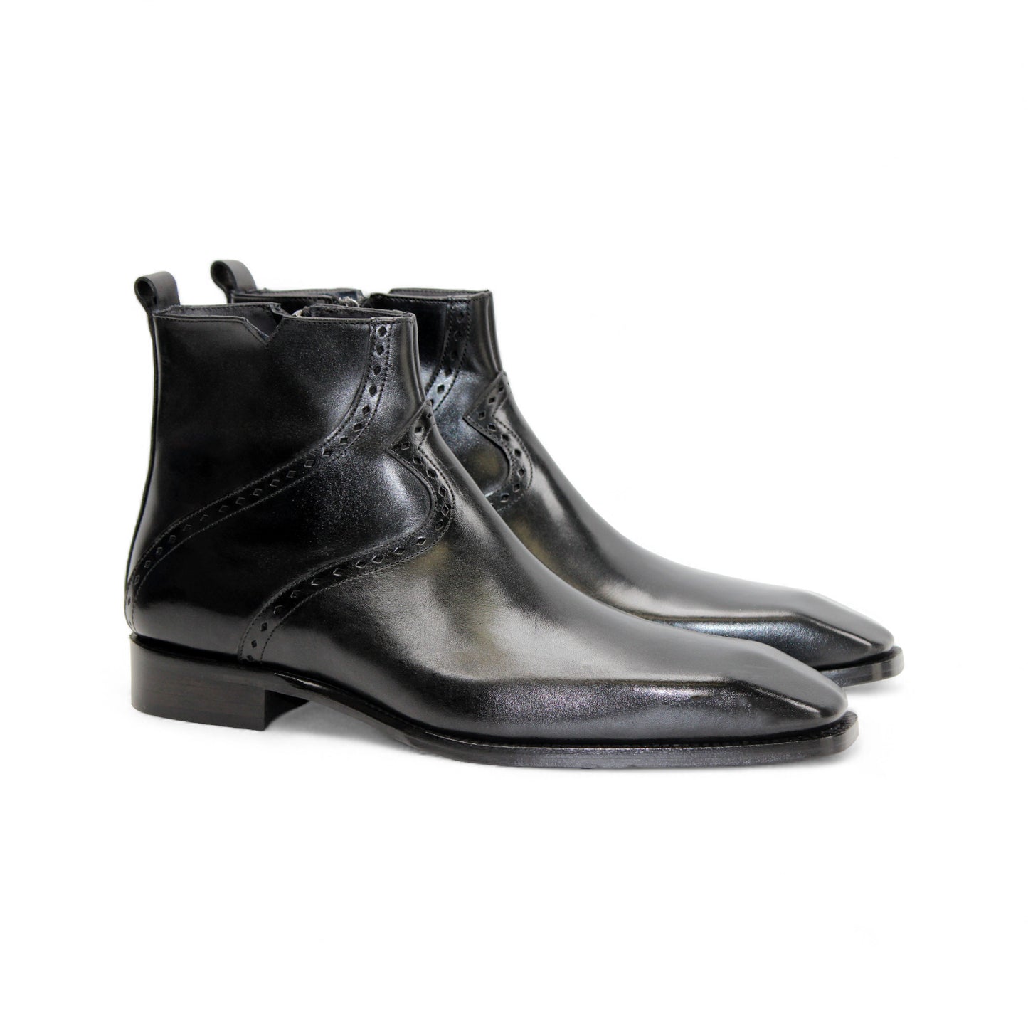 The Duca Di Matiste Duca Pedaso Black is a genuine leather ankle boot with decorative stitching, low heel, and side zipper, shown on a white background—crafted for timeless style.