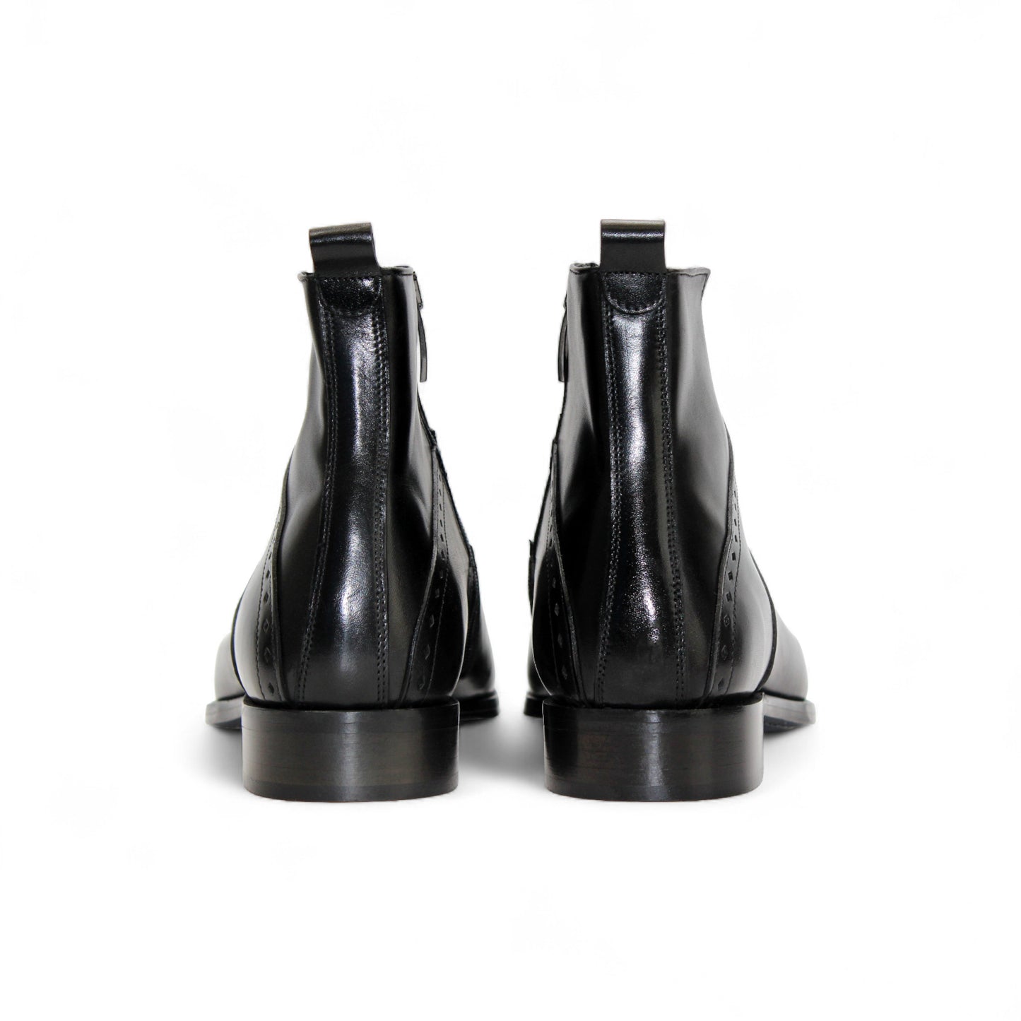 The Duca Di Matiste Duca Pedaso Black is a genuine leather ankle boot with decorative stitching, low heel, and side zipper, shown on a white background—crafted for timeless style.