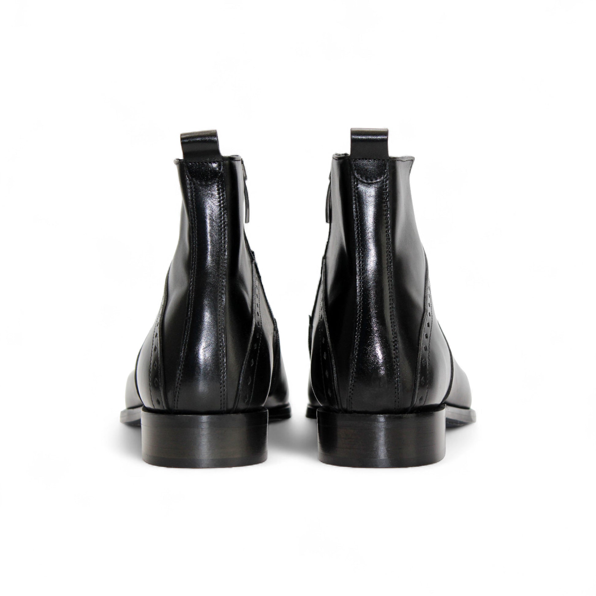 The Duca Di Matiste Duca Pedaso Black is a genuine leather ankle boot with decorative stitching, low heel, and side zipper, shown on a white background—crafted for timeless style.