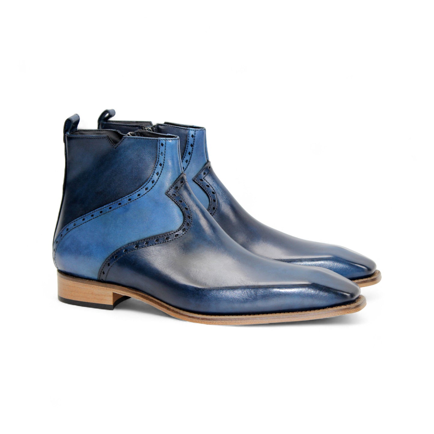 The Duca Pedaso Navy by Duca Di Matiste is a genuine leather ankle boot in blue, featuring black stitching, a side zipper, low wooden heel, and pointed toe, displayed in profile against a white background.