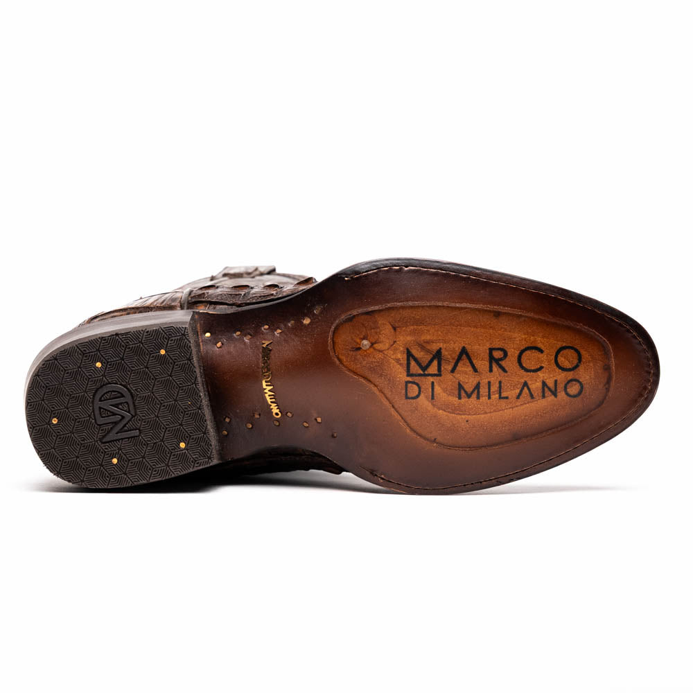 A pair of Marco Di Milano Phoenix Aged Brown men's boots, one upright and one showing the sole, crafted from genuine caiman belly skin with a crocodile texture and detailed stitching—ideal for any Western collection.