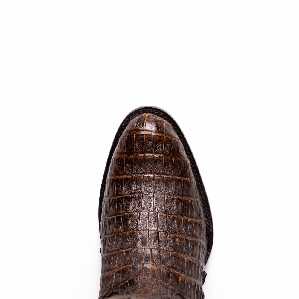 A pair of Marco Di Milano Phoenix Aged Brown men's boots, one upright and one showing the sole, crafted from genuine caiman belly skin with a crocodile texture and detailed stitching—ideal for any Western collection.
