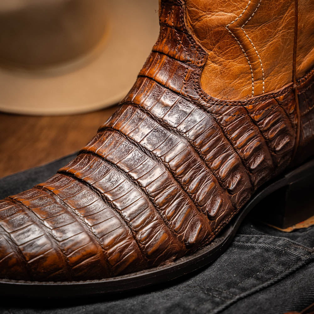 The Marco Di Milano Phoenix Aged Maple boots feature a textured brown full-grain leather foot, a lighter tan shaft, and display one boot upright while the other shows the branded sole.