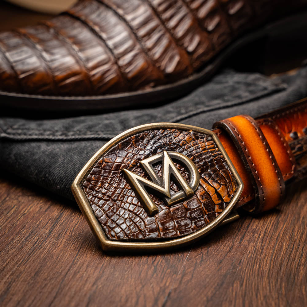 The Marco Di Milano Phoenix Aged Maple boots feature a textured brown full-grain leather foot, a lighter tan shaft, and display one boot upright while the other shows the branded sole.