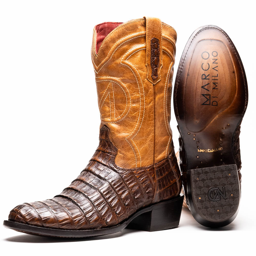 The Marco Di Milano Phoenix Aged Maple boots feature a textured brown full-grain leather foot, a lighter tan shaft, and display one boot upright while the other shows the branded sole.