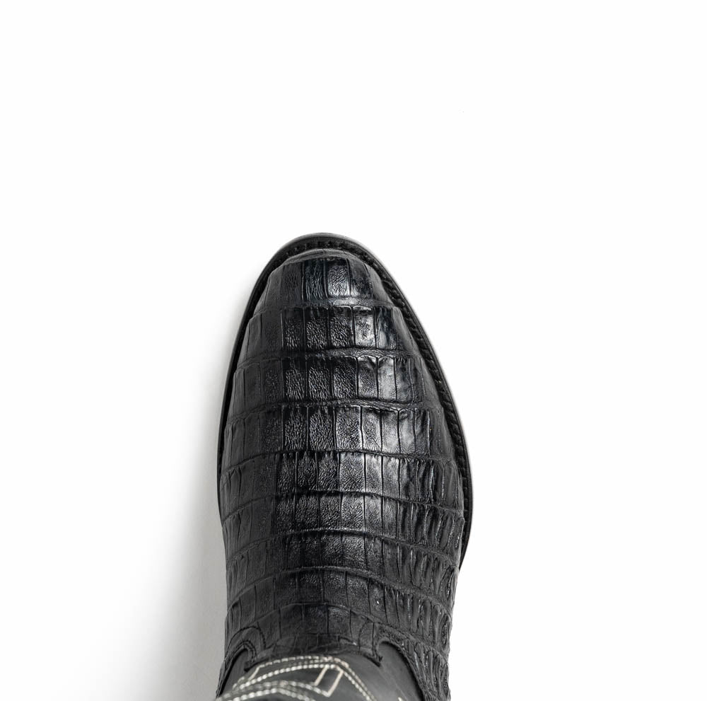 A pair of Phoenix Black Western cowboy boots by Marco Di Milano, one upright and one showing the sole, featuring a textured pattern and the brand name on the sole.