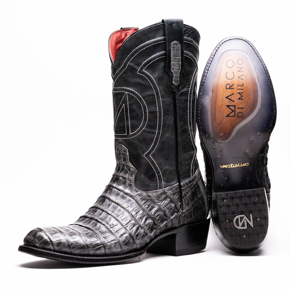 A pair of Phoenix Stone Gray cowboy boots by Marco Di Milano—one boot upright and the other displaying the branded sole.