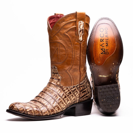 A pair of Phoenix Stone Orix brown Western cowboy boots by Marco Di Milano, featuring an alligator texture—one boot upright, the other displaying the sole with the brand logo.