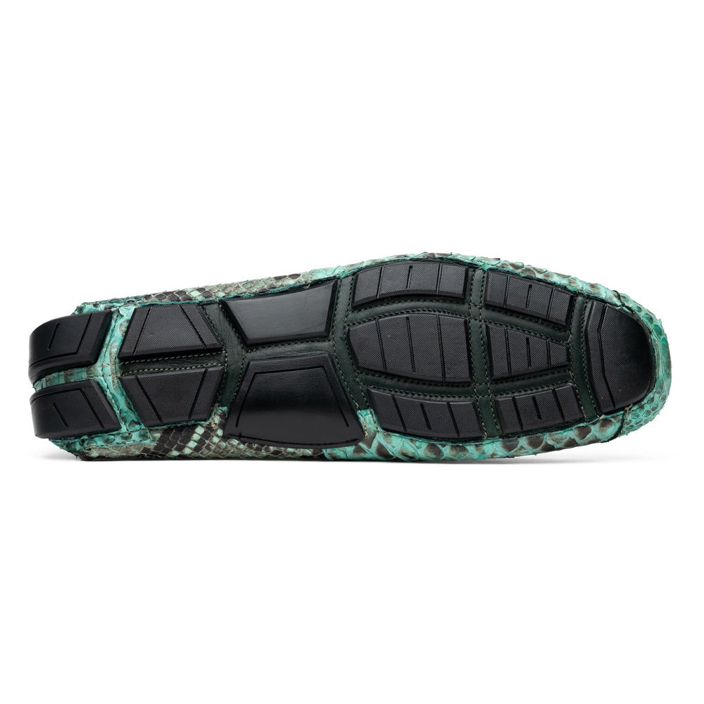 Introducing the Pia Aqua by Marco Di Milano—a pair of luxury men’s loafers handcrafted from striking green python skin. Featuring black rubber soles and silver buckle accents, one shoe is elegantly displayed on its side to highlight the distinctive design of this opulent driver shoe.