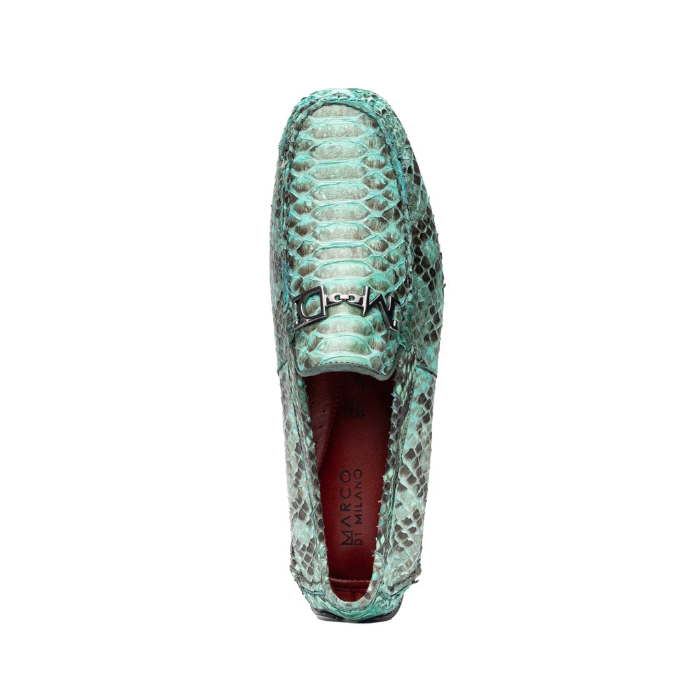Introducing the Pia Aqua by Marco Di Milano—a pair of luxury men’s loafers handcrafted from striking green python skin. Featuring black rubber soles and silver buckle accents, one shoe is elegantly displayed on its side to highlight the distinctive design of this opulent driver shoe.