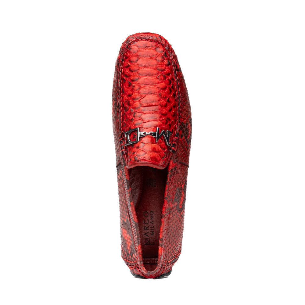 A pair of Pia Red loafers by Marco Di Milano—crafted as luxury men’s driver shoes in a striking red snakeskin pattern, featuring black rubber soles and silver buckle detailing, with one shoe upright and the other displayed on its side—showcase the allure of exotic python-inspired style in a distinguished design.