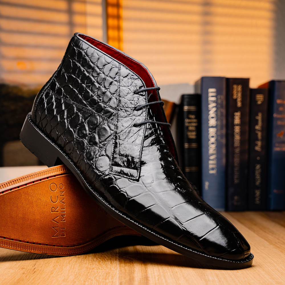 Experience luxury with Marco Di Milano's Pietro Black men's lace-up boots—crafted in black, crocodile-patterned leather with dark laces and brown leather soles.