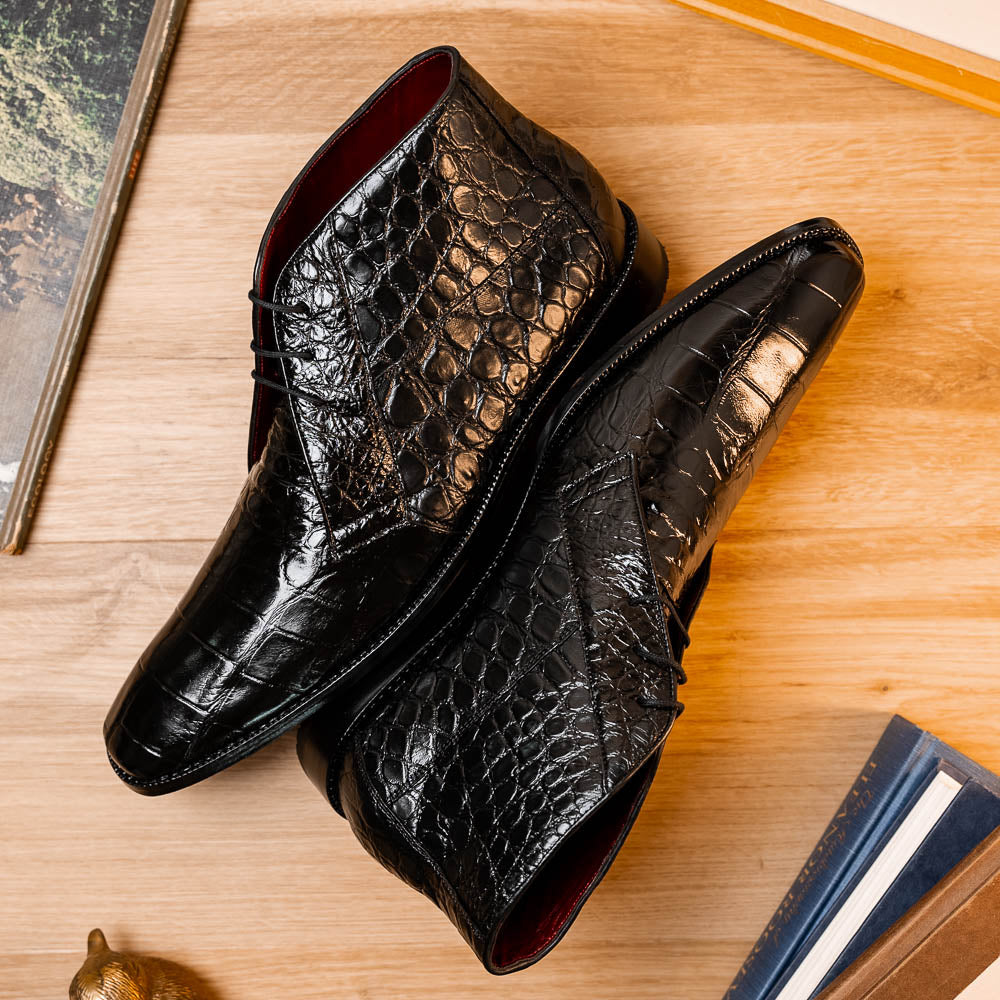 Experience luxury with Marco Di Milano's Pietro Black men's lace-up boots—crafted in black, crocodile-patterned leather with dark laces and brown leather soles.