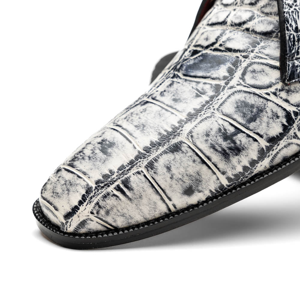 The Pietro Newspaper by Marco Di Milano: men's ankle-high dress boots with a white and black crocodile pattern, black laces, brown leather soles, and hand painted finishes—luxury footwear for a distinctive look.