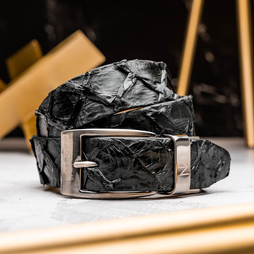The Olivieri Belt Black by Marco Di Milano is a textured genuine pirarucu belt with a silver buckle, featuring the brand's logo—a refined accessory that pairs seamlessly with Marco Di Milano luxury footwear.