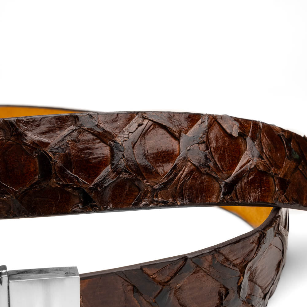 The Olivieri Belt Brown by Marco Di Milano is a genuine pirarucu leather belt with a textured finish, silver buckle, and "MD" initials—ideal for pairing with luxury footwear.
