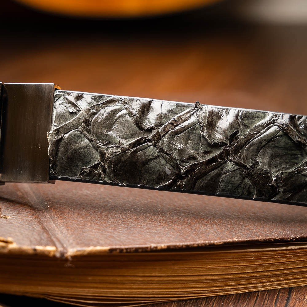 The Olivieri Belt Gray by Marco Di Milano features textured genuine leather in gray with a metallic rectangular buckle engraved with the brand’s initials—a refined accessory to complement luxury footwear.