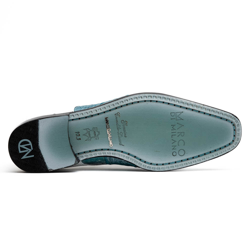 The "Pissa Aqua/White" by Marco Di Milano is a men's dress shoe with a white textured upper, teal blue patterned lower, hand-painted finishes, white laces, and a black sole—showcasing luxury style and craftsmanship.