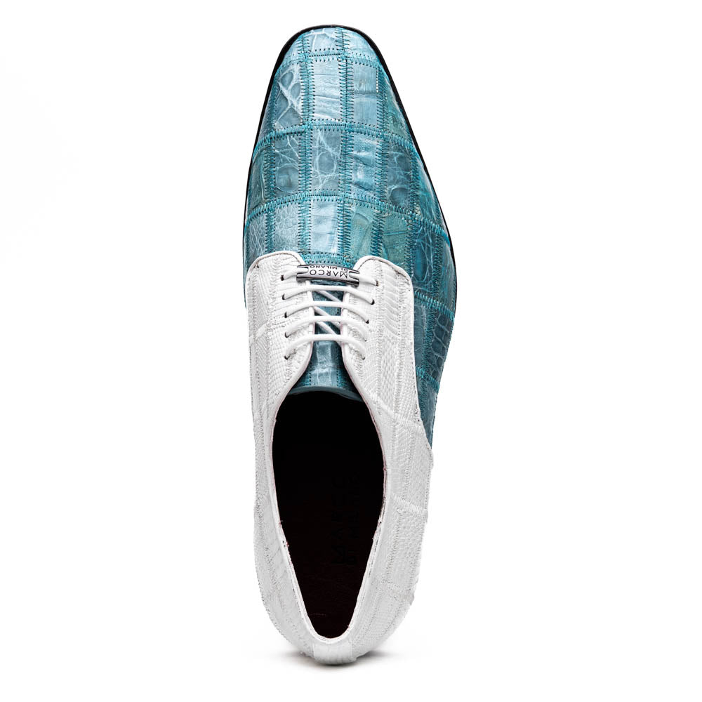 The "Pissa Aqua/White" by Marco Di Milano is a men's dress shoe with a white textured upper, teal blue patterned lower, hand-painted finishes, white laces, and a black sole—showcasing luxury style and craftsmanship.