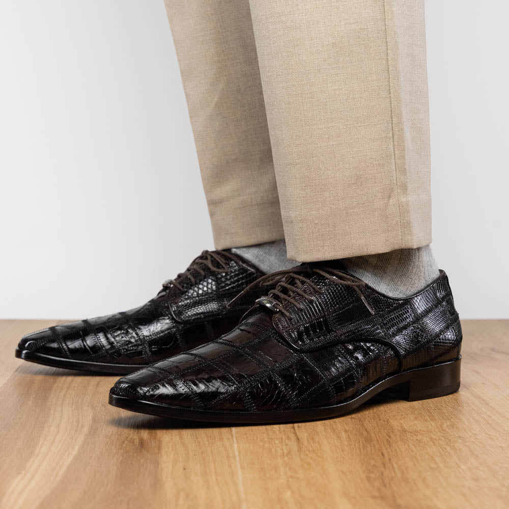 A pair of Marco Di Milano Pissa Brown textured leather dress shoes, with one shoe upright and the other on its side to showcase the sole.