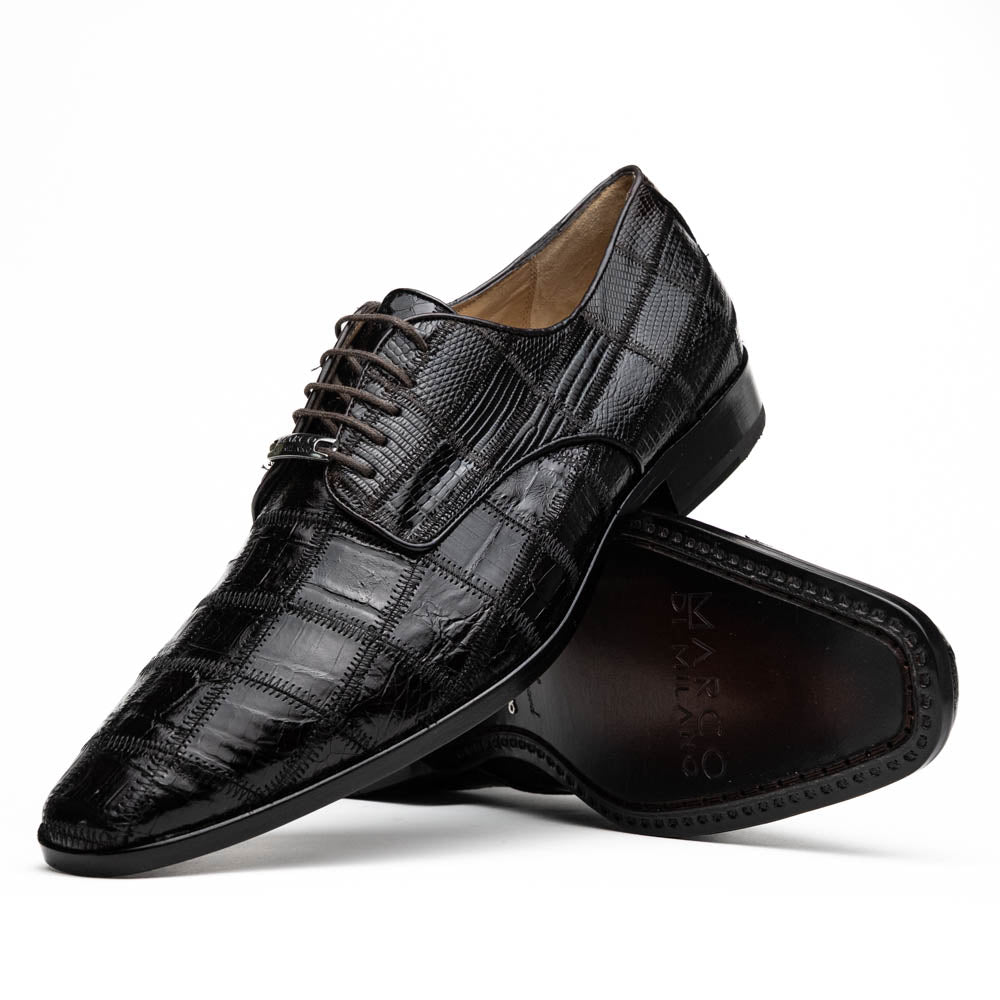 A pair of Marco Di Milano Pissa Brown textured leather dress shoes, with one shoe upright and the other on its side to showcase the sole.