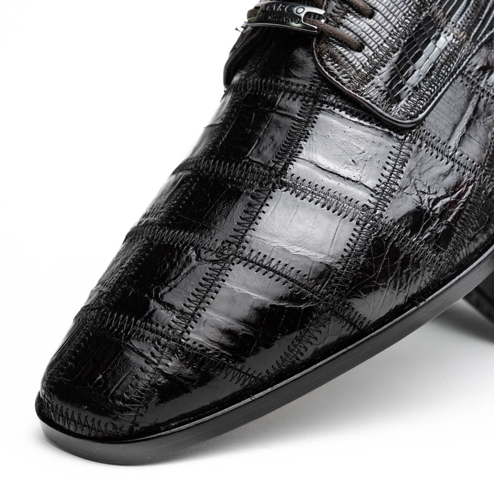 A pair of Marco Di Milano Pissa Brown textured leather dress shoes, with one shoe upright and the other on its side to showcase the sole.