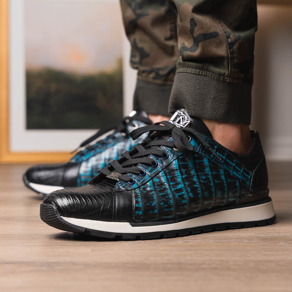 The Marco Di Milano Portici Navy / Black sneaker with black laces, a white midsole, and a textured black rubber outsole is shown on a plain white background, emphasizing its luxurious design.