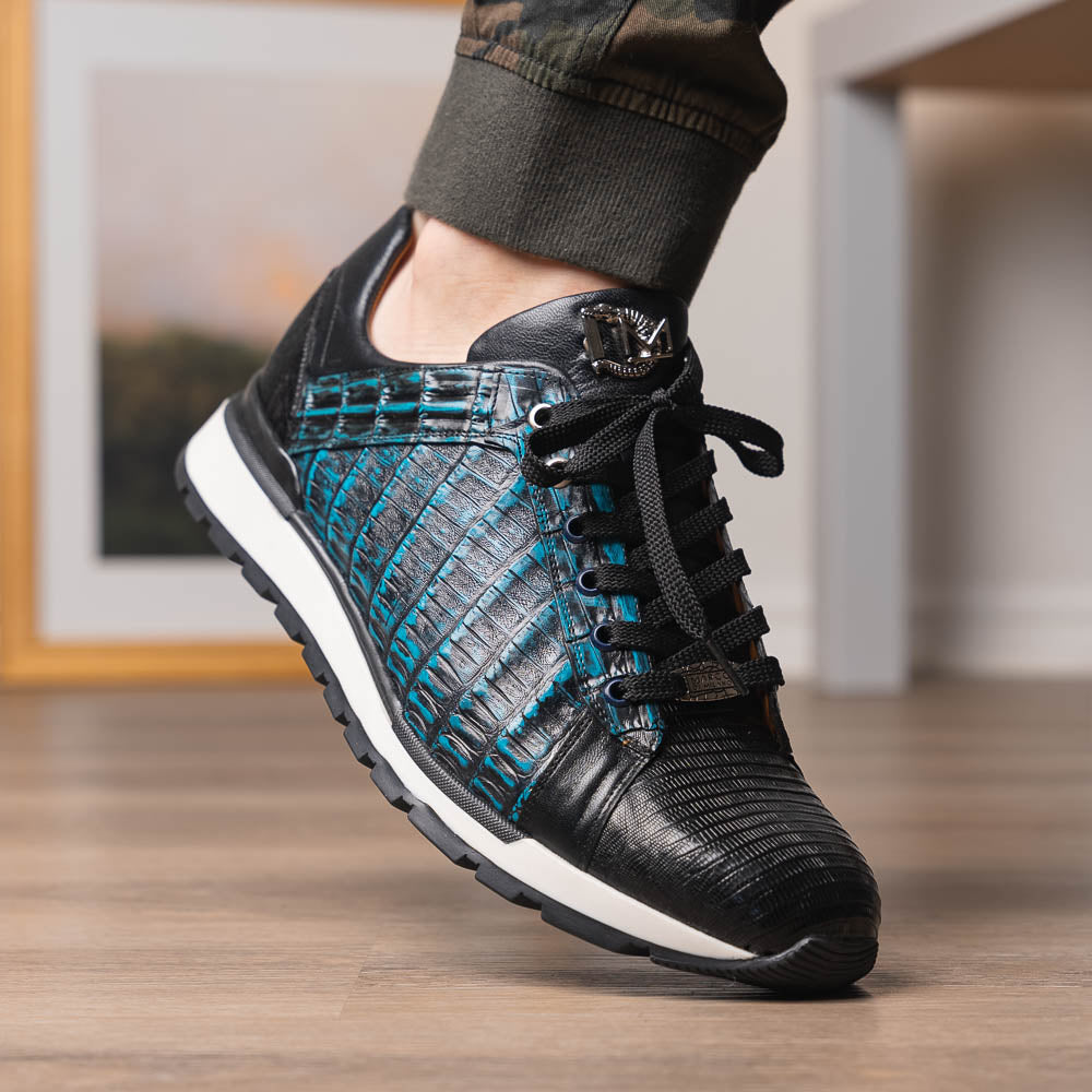 The Marco Di Milano Portici Navy / Black sneaker with black laces, a white midsole, and a textured black rubber outsole is shown on a plain white background, emphasizing its luxurious design.