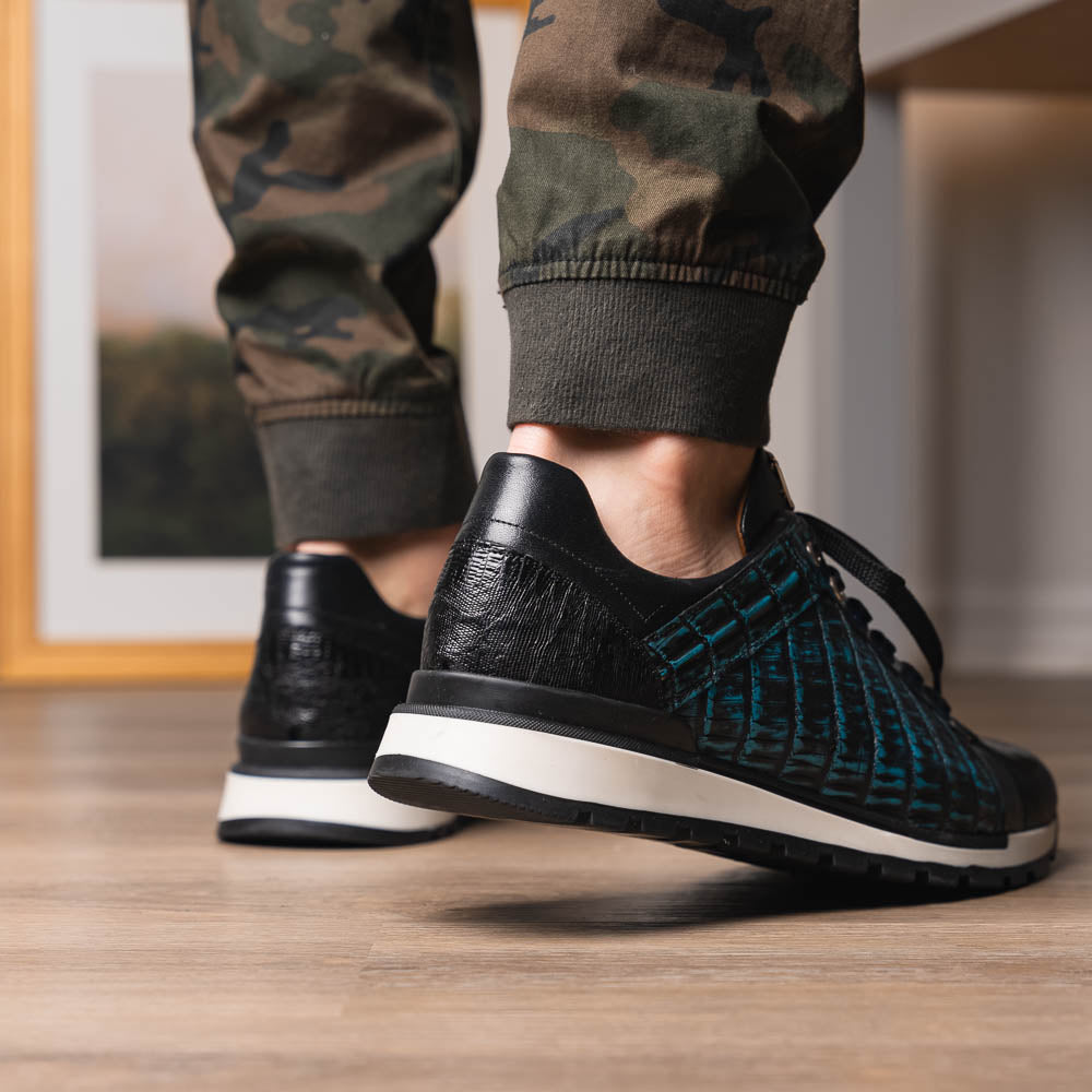 The Marco Di Milano Portici Navy / Black sneaker with black laces, a white midsole, and a textured black rubber outsole is shown on a plain white background, emphasizing its luxurious design.