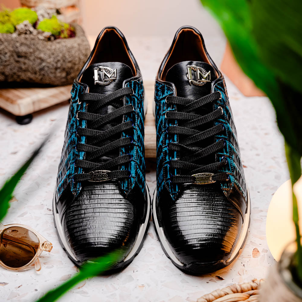 The Marco Di Milano Portici Navy / Black sneaker with black laces, a white midsole, and a textured black rubber outsole is shown on a plain white background, emphasizing its luxurious design.
