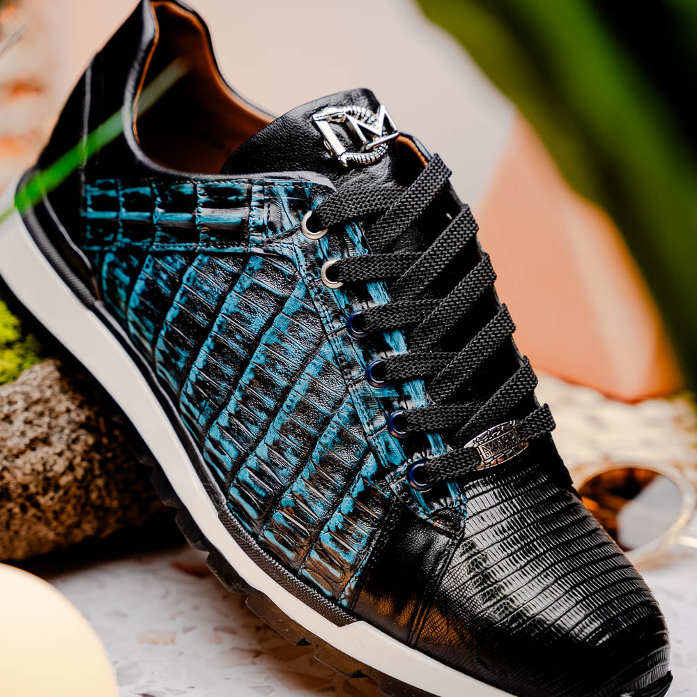 The Marco Di Milano Portici Navy / Black sneaker with black laces, a white midsole, and a textured black rubber outsole is shown on a plain white background, emphasizing its luxurious design.