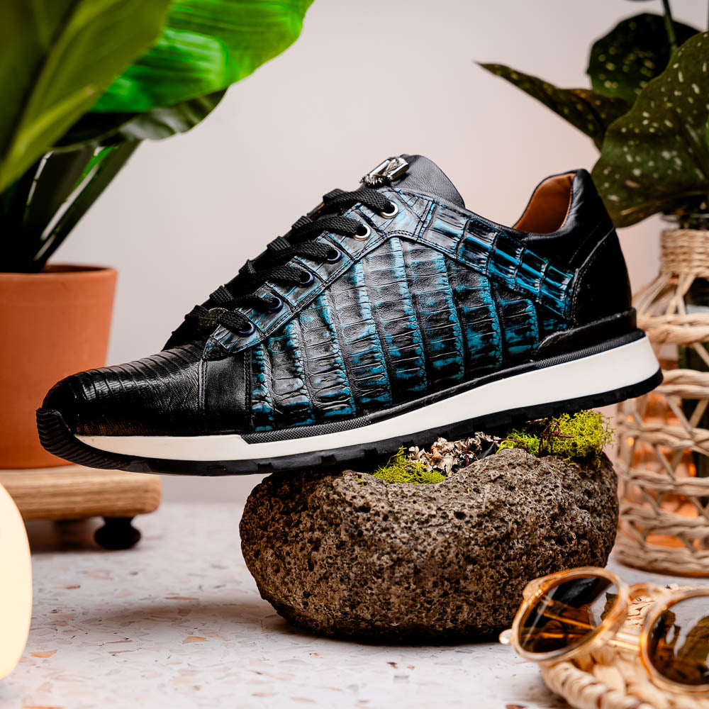 The Marco Di Milano Portici Navy / Black sneaker with black laces, a white midsole, and a textured black rubber outsole is shown on a plain white background, emphasizing its luxurious design.