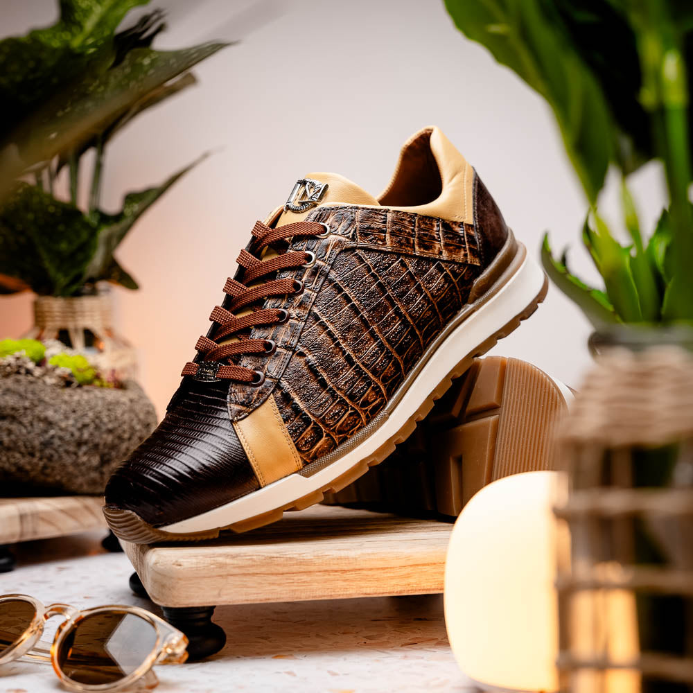 The Portici Orix / Brown by Marco Di Milano features a brown and tan faux crocodile texture, brown laces, white midsole, and a tan-brown rubber sole, delivering luxury style on a white background.