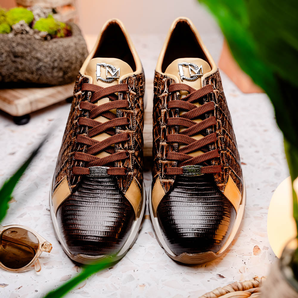 The Portici Orix / Brown by Marco Di Milano features a brown and tan faux crocodile texture, brown laces, white midsole, and a tan-brown rubber sole, delivering luxury style on a white background.